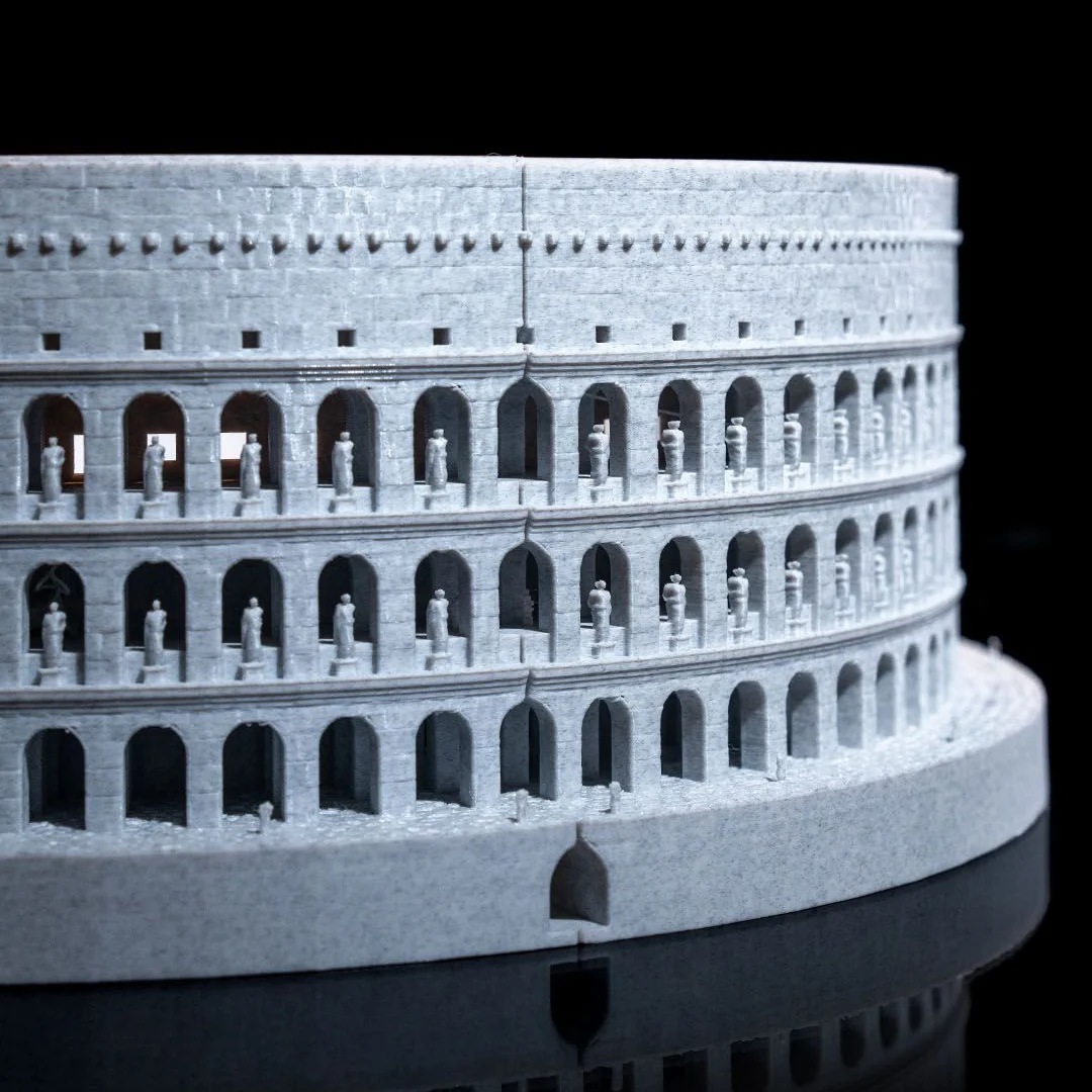 Close view of a Colosseum model showing repeated arches and entrance details.