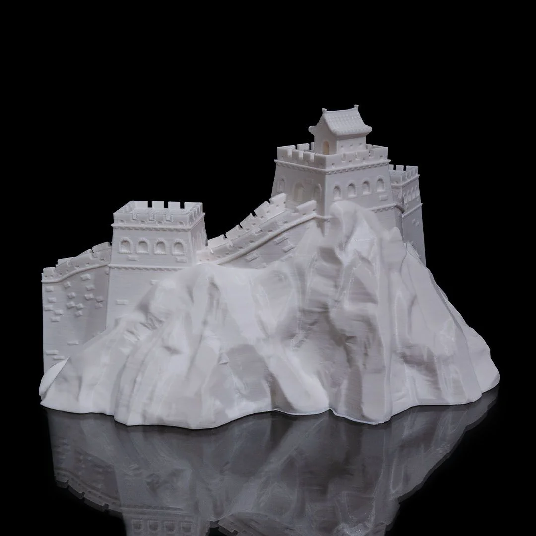Rear angled view of a Great Wall of China model on a rocky landscape base.