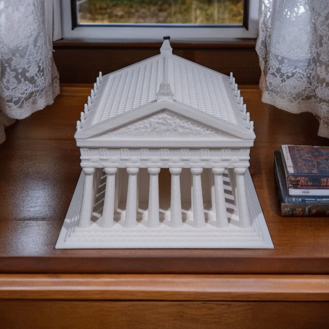 Front tabletop view of a Parthenon model showing the colonnade and pediment.