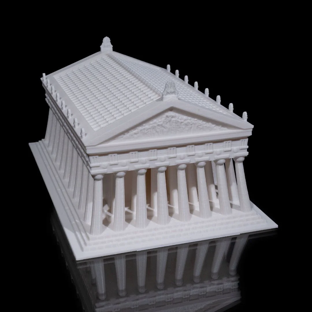 Elevated angled view of a Parthenon model showing roof and facade details.