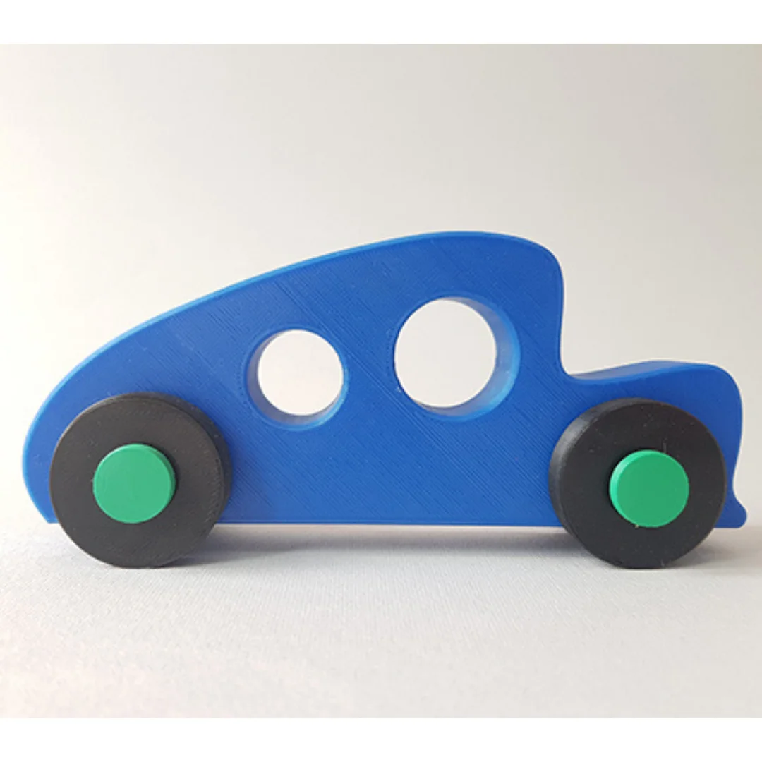 Side view of a 3D printed classic car model with round window openings and wheels.
