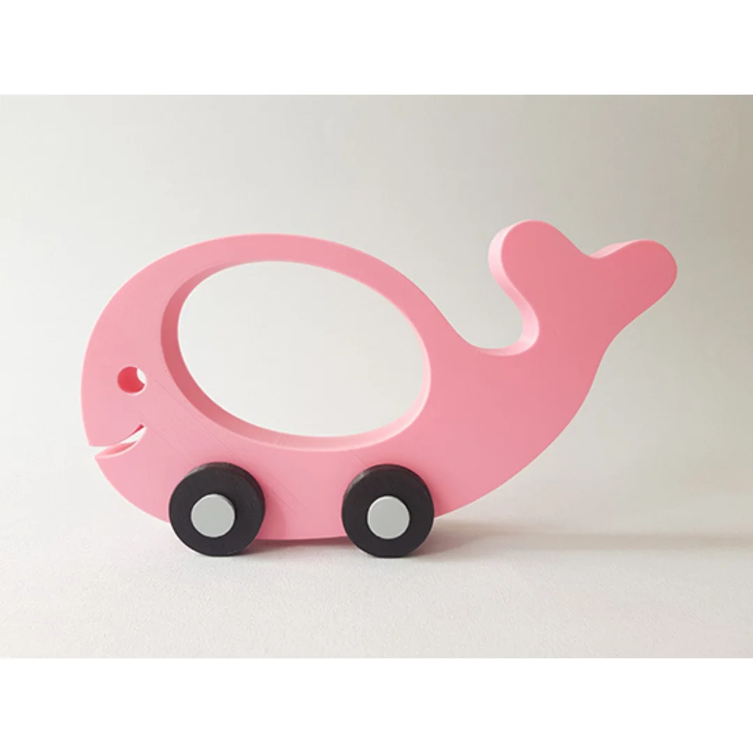 Fish-shaped wheeled model with a curved tail and oval opening in the body.