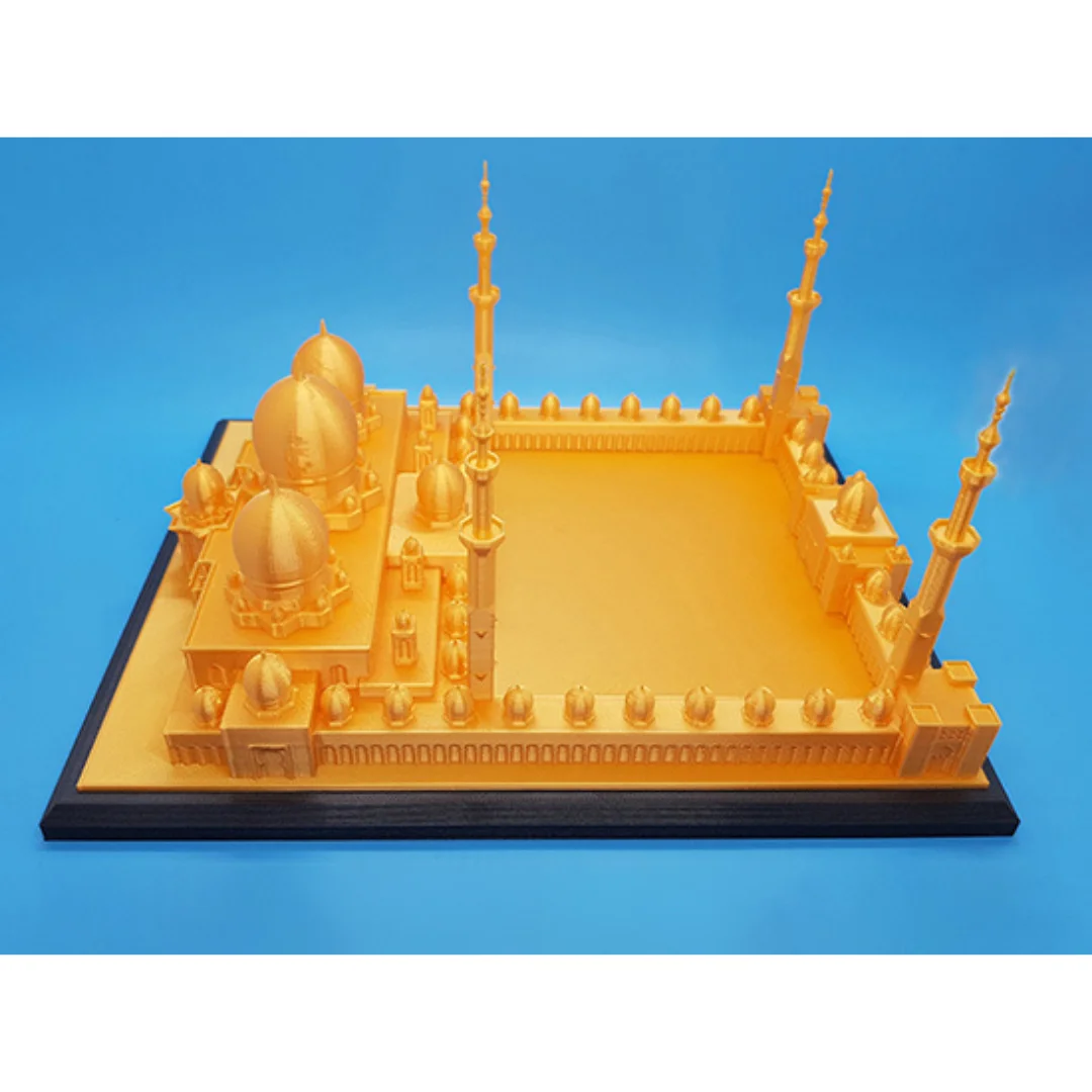 Elevated side view of a Sheikh Zayed Grand Mosque model with courtyard and domes.