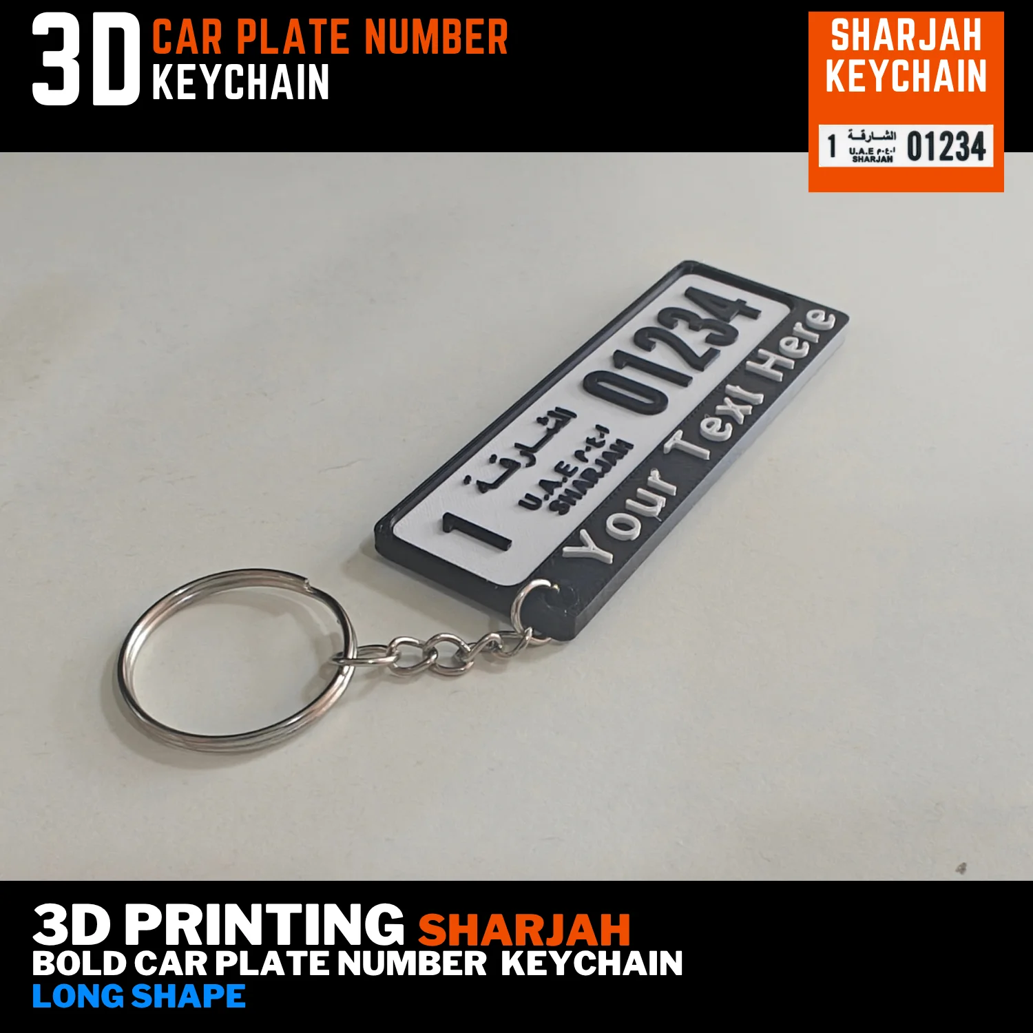 Sharjah old long number plate keychain with a white plate, black custom name bar and silver keyring